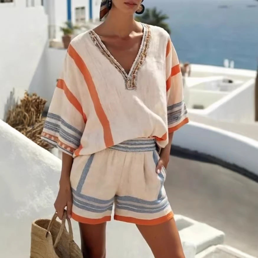 A woman wearing a Women’s Linen Striped V-Neck Top and Shorts Set in a casual summer setting.