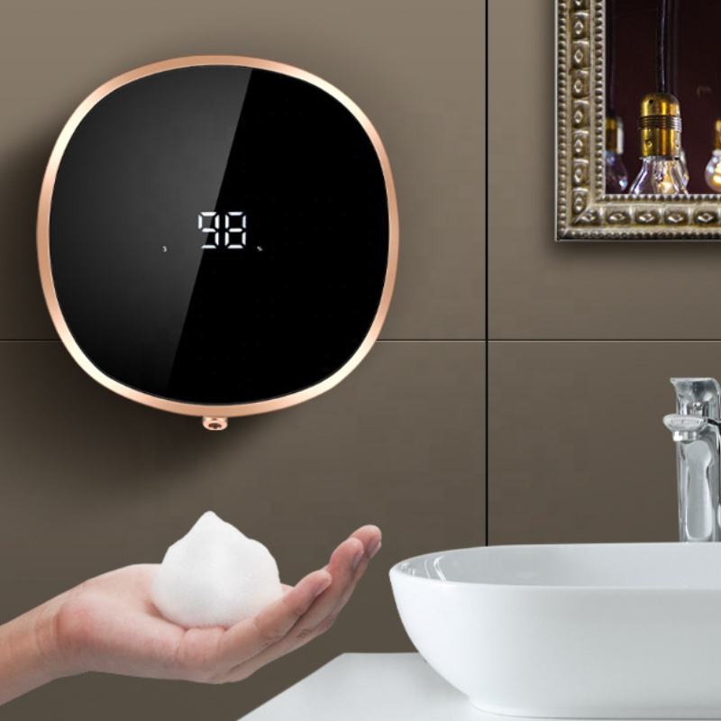 White automatic infrared liquid foam soap dispenser on a clean bathroom countertop