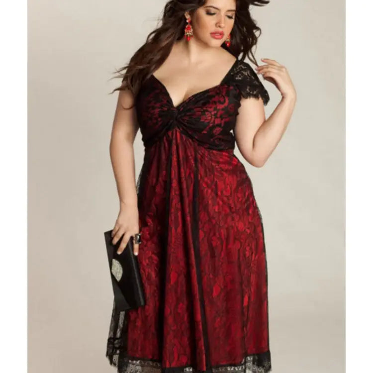 A woman wearing a Gothic-style lace midi dress with a V-neckline, cap sleeves, and a twist-front bodice, available in solid black or black-and-red.
