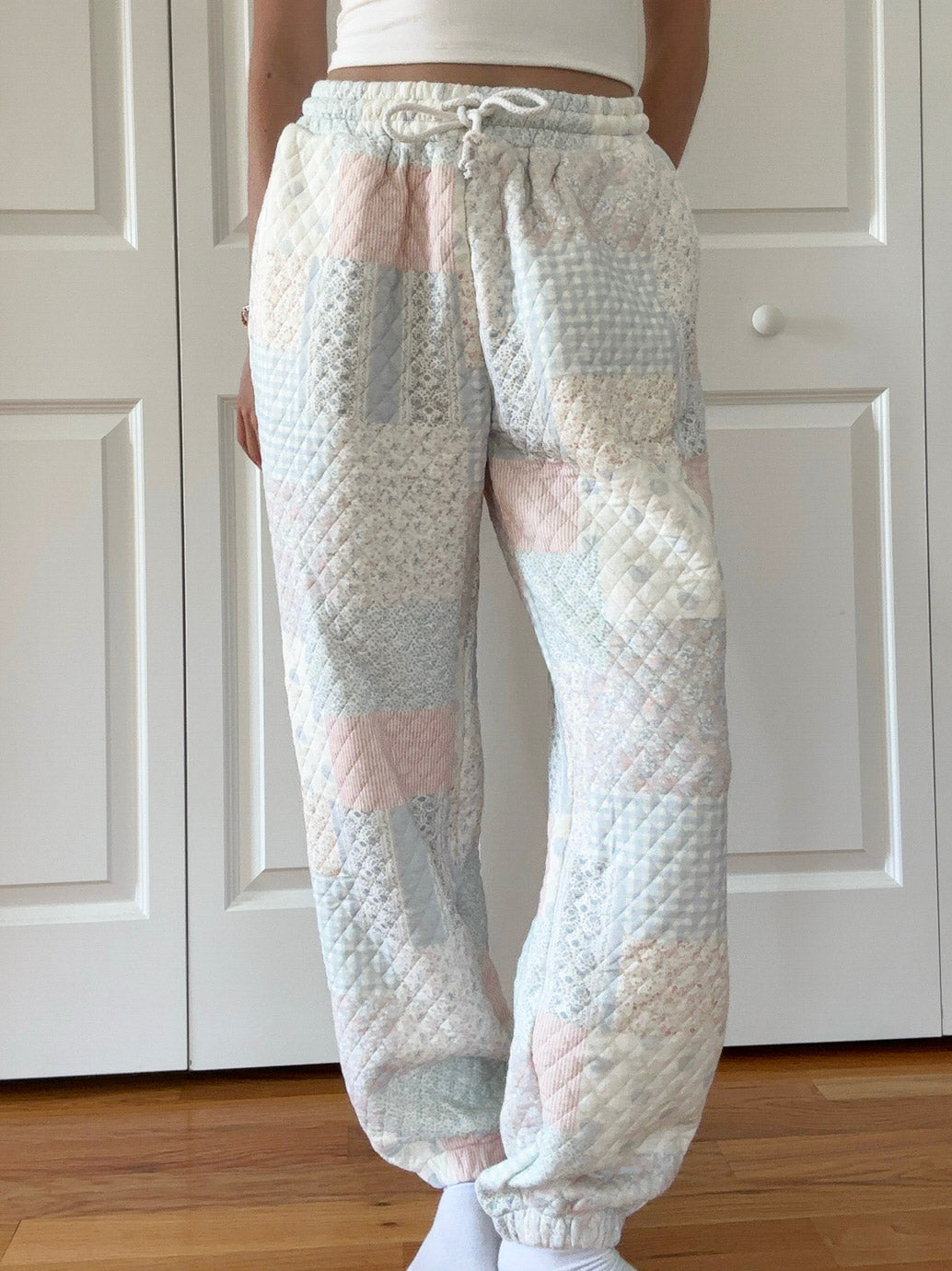 Model wearing Shades Of Blue Quilted Pastel Joggers in an oversized comfortable fit