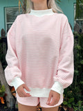 Light pink and white striped mockneck sweatshirt featuring a relaxed unisex fit.