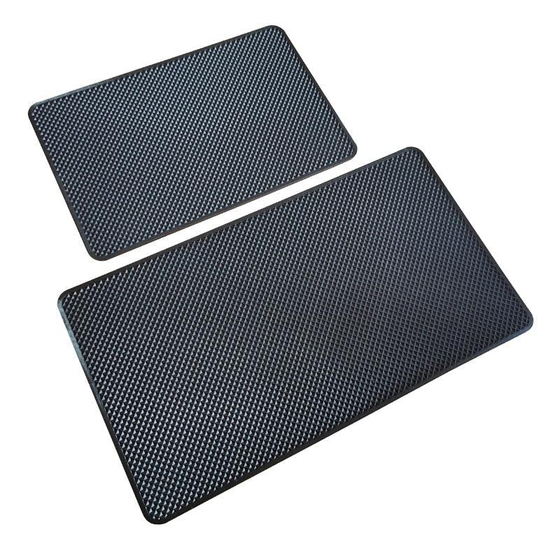 A black geometric non-slip silicone dashboard mat for holding phones and small items