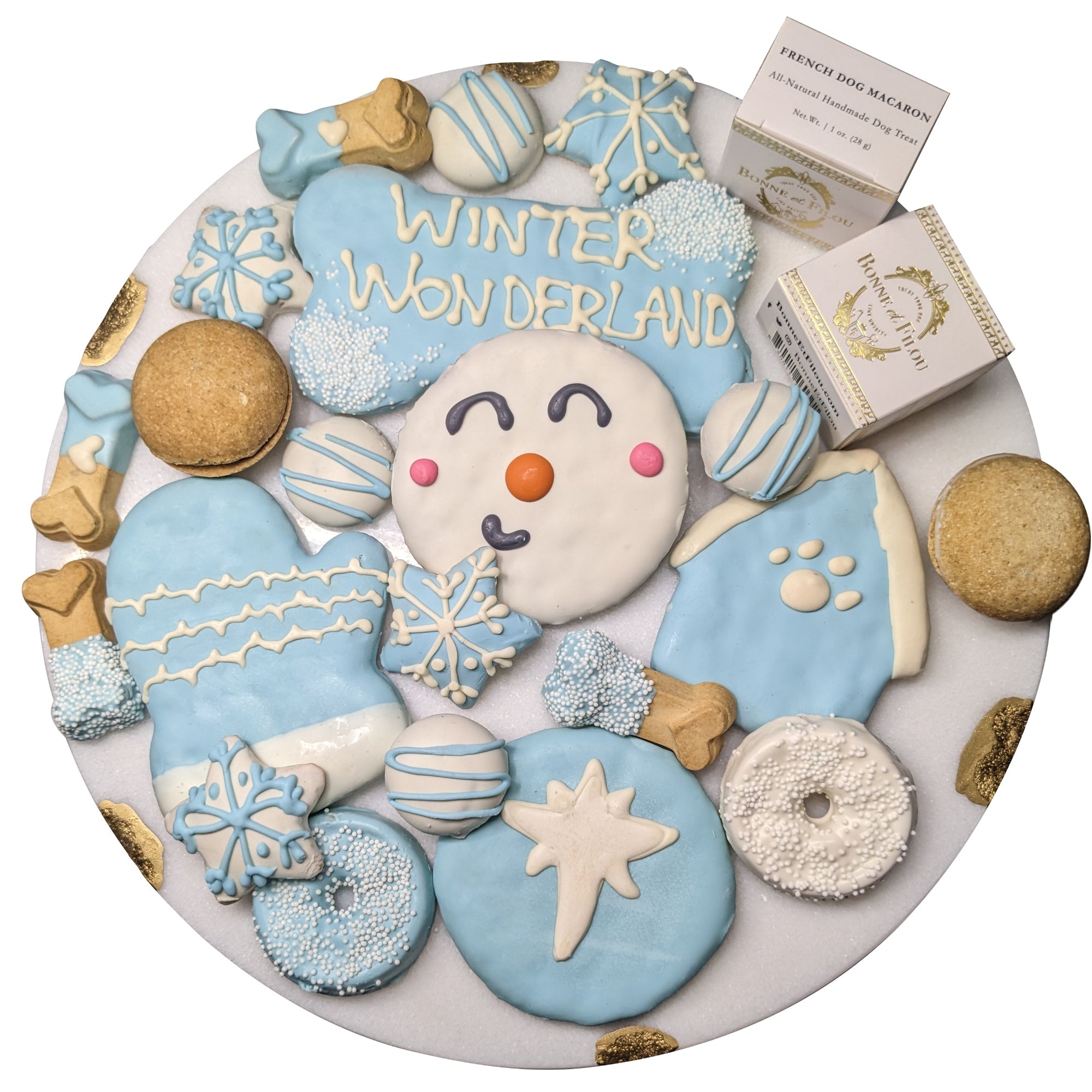 A festive winter themed gift box filled with 21 assorted decorated dog treats including snowmen and snowflakes.
