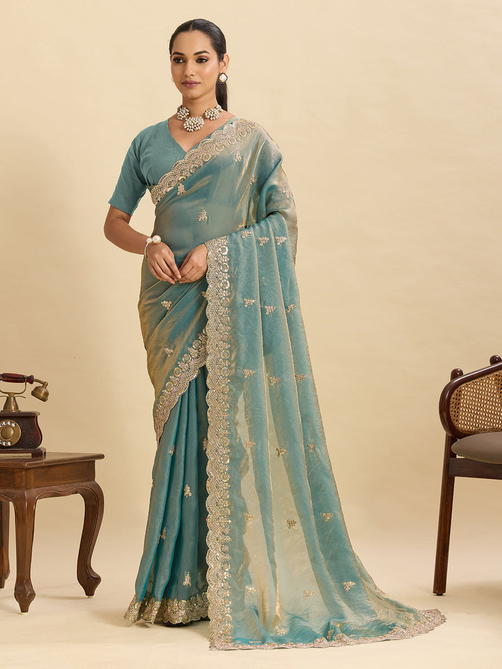 Seagreen Fendy Satin saree with heavy gold embroidery and double sequence work details