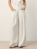 High-waisted 100% linen pants featuring structured front pleats and an elasticated back in a relaxed silhouette.
