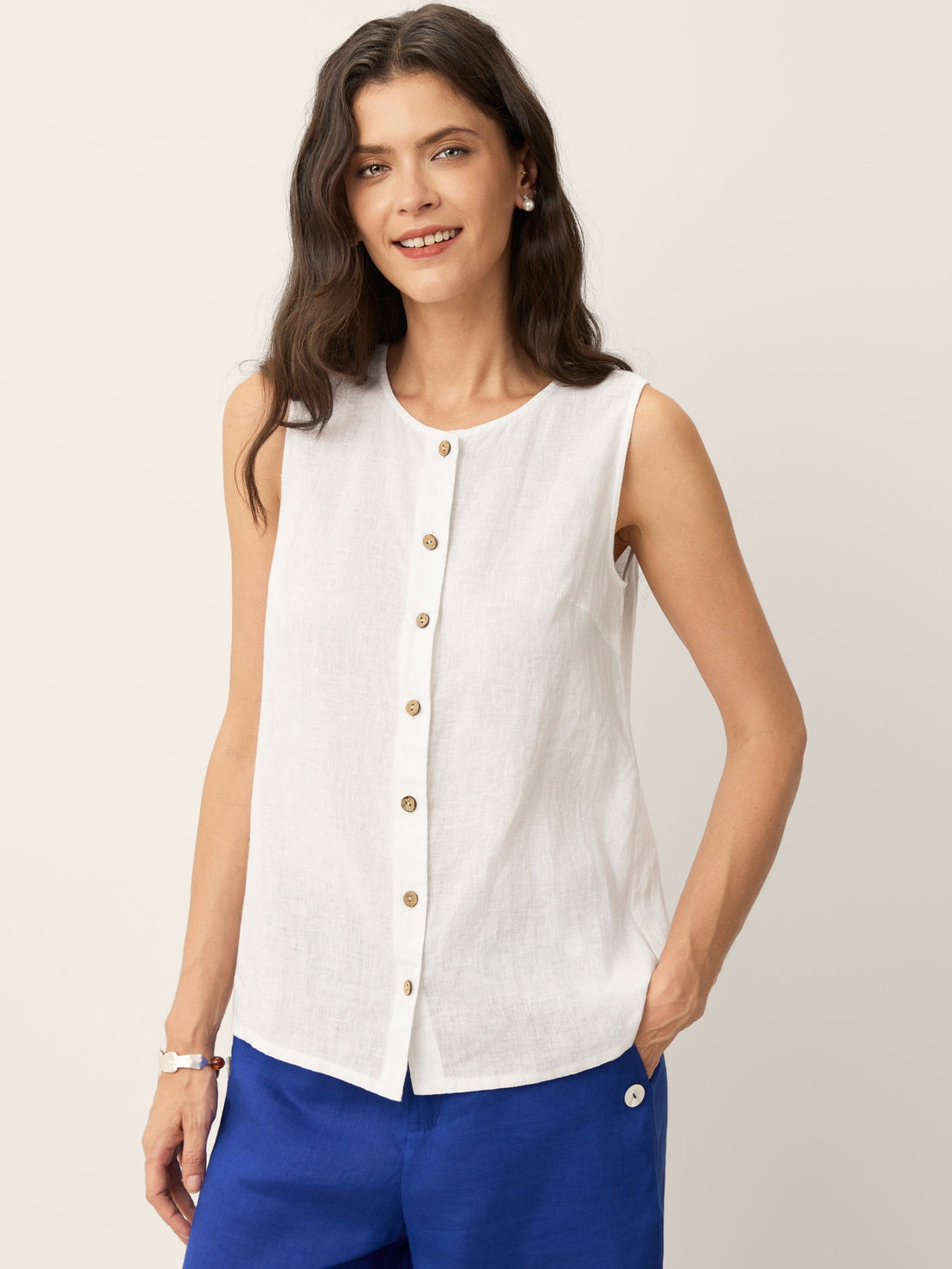 Close up of 100% linen sleeveless button-down tank top in neutral tones