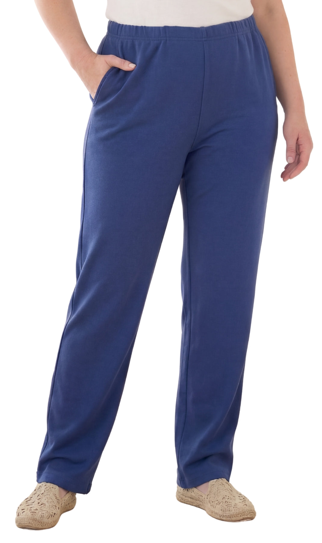 Woman wearing comfortable flat-front knit pants with straight leg silhouette in solid color