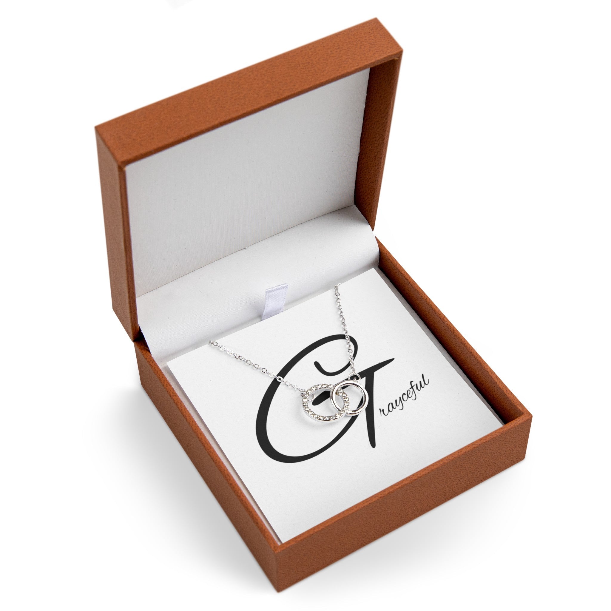 Polished silver interlocking circles necklace with pave cubic zirconia accents on a cable chain