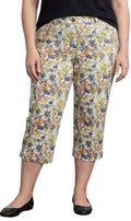 Women's white capri pants featuring a colorful botanical floral print and front pockets
