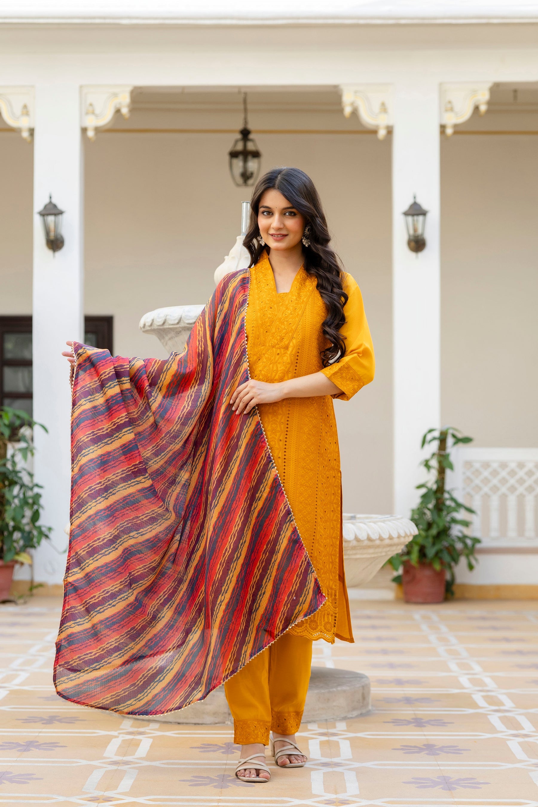 Mustard Roman Silk kurta set with intricate Chikan Kari embroidery, including pants and dupatta