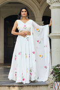 White georgette lehenga choli with hand-painted floral motifs and matching dupatta