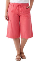 Woman wearing coral Calcutta cotton split skirt culottes with cargo pockets and a casual top
