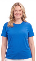 A woman wearing a minimalist relaxed fit crew neck cotton blend t-shirt in solid color