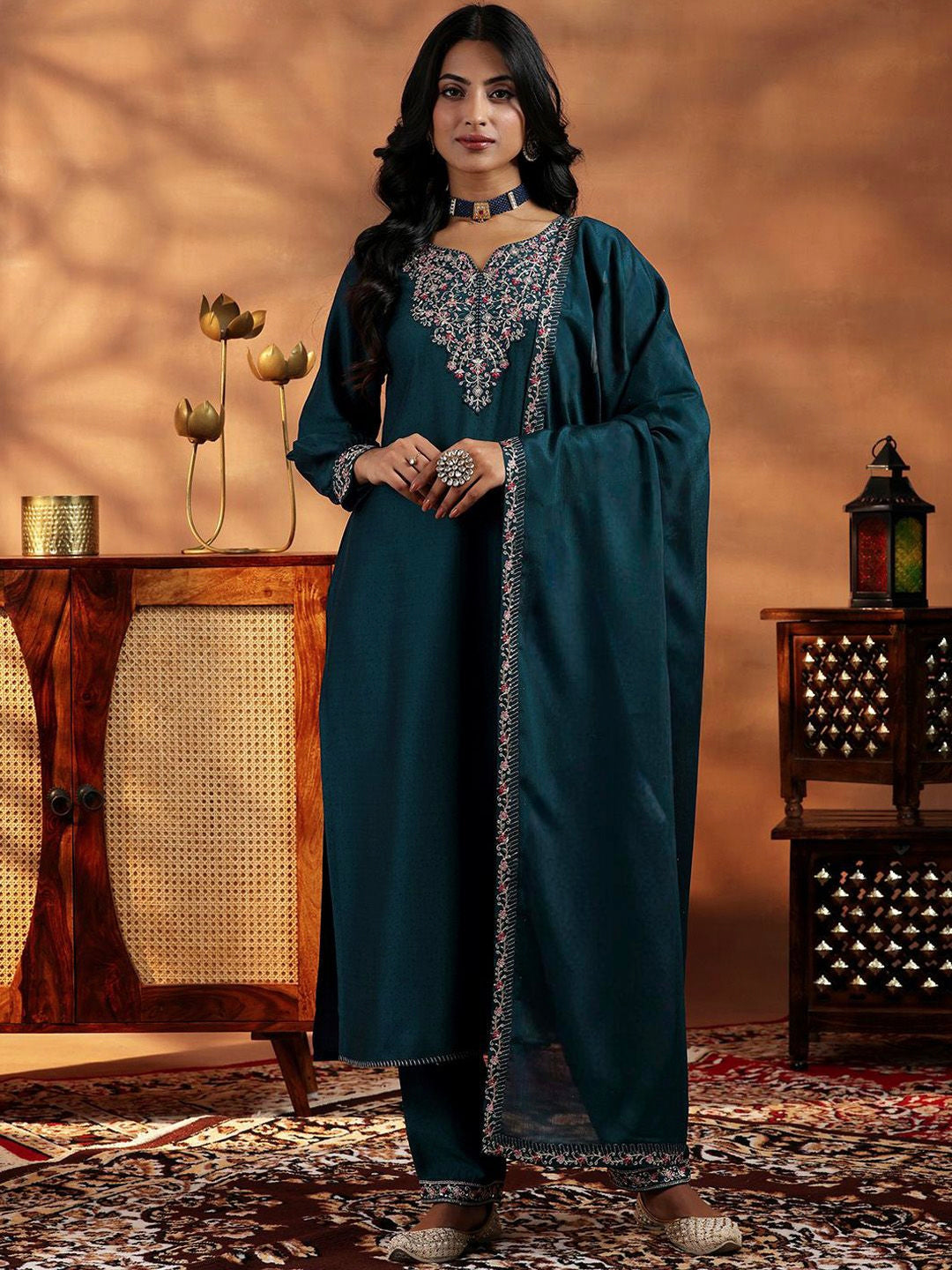 Woman wearing a Rama Mustard Vichitra Silk Salwar Suit with gold embroidery and gota patti work
