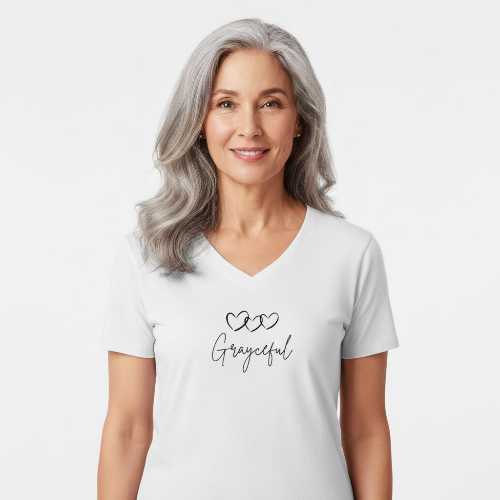 Woman wearing a white V-neck cotton t-shirt with a 3 hearts graphic design