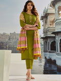 Woman wearing an olive-green muslin cotton salwar suit with pink and mustard geometric embroidery and dupatta.