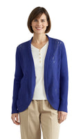 Women's lightweight metallic glitter knit shrug in a shimmering finish, worn as an open-front layer.