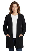 Close up of a classic longline cable knit duster cardigan with pockets in camel