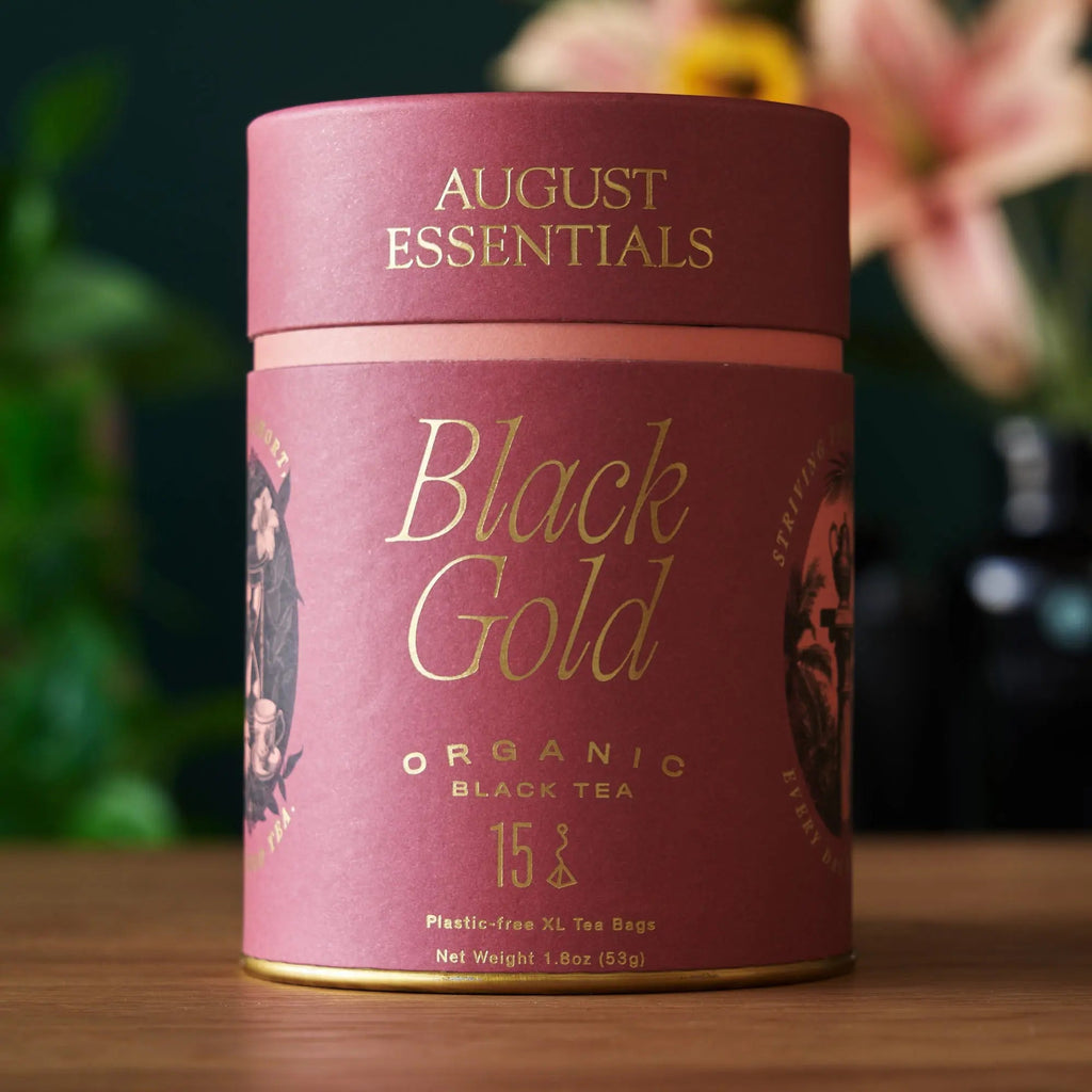 Cylindrical red canister of Black Gold organic Yunnan black tea bags