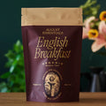 A dark brown pouch of August Uncommon Tea Essentials English Breakfast loose leaf tea, 50 grams.