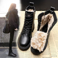 A woman wearing black waterproof combat snow boots with a chunky sole and faux fur lining, styled in Harajuku fashion for winter.