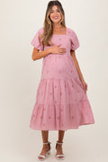 Pink maternity midi dress featuring a square neckline and delicate eyelet fabric detail.