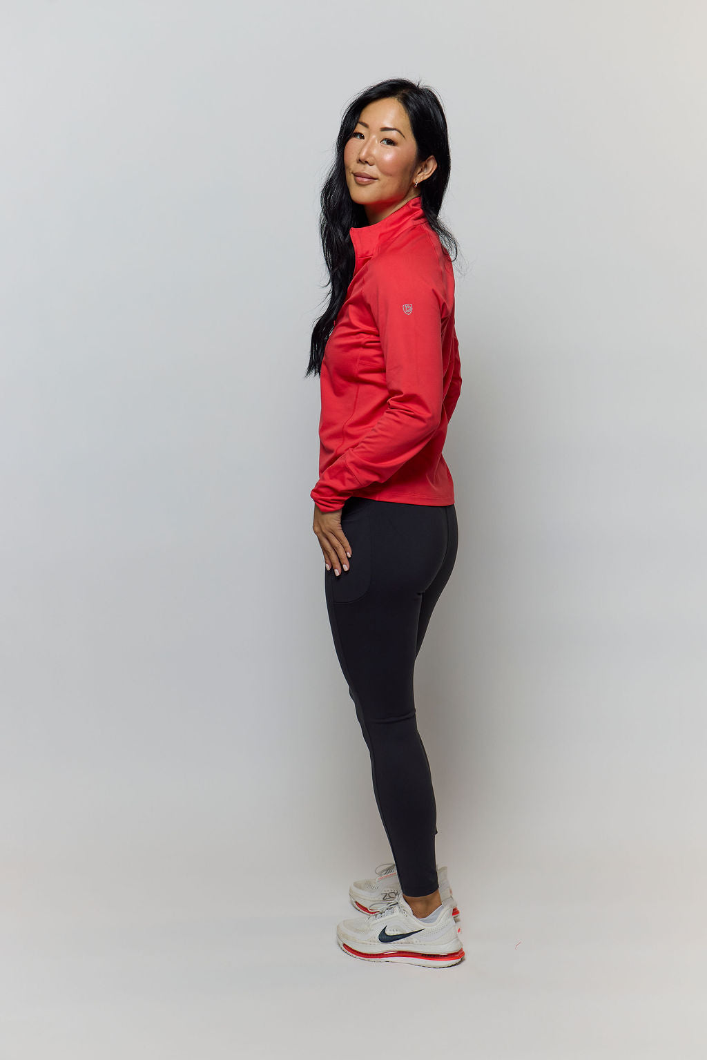 Woman wearing high-rise Go Again full length leggings with side pockets