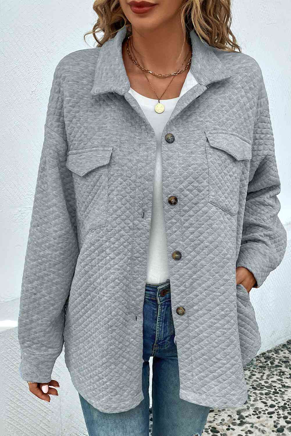 Classic lightweight button-down collared jacket with functional pockets and a structured silhouette.