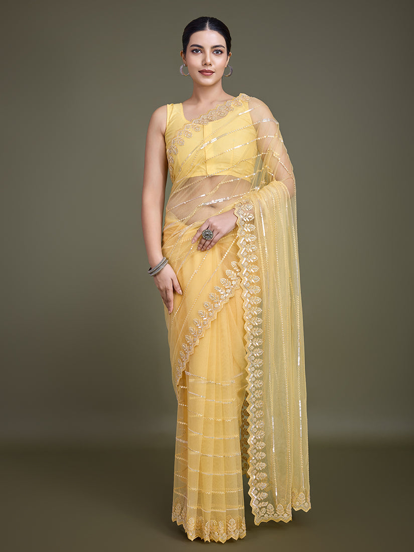 Glamorous yellow soft net saree featuring heavy sequin embellishments