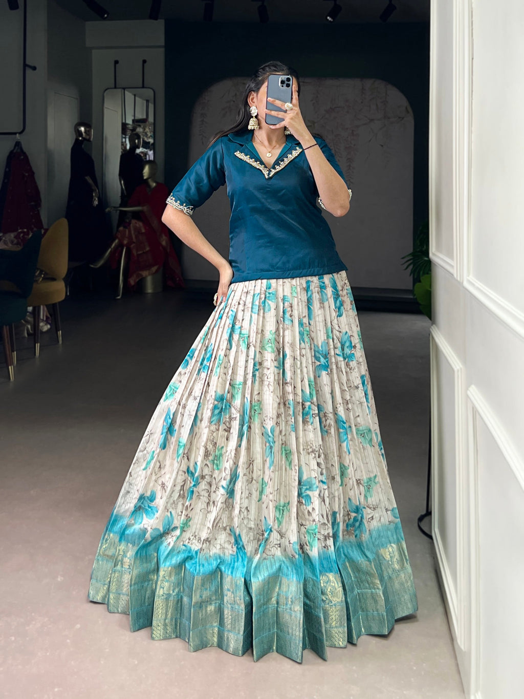Teal colored Dola Chex lehenga choli featuring floral prints and decorative Zari weaving border