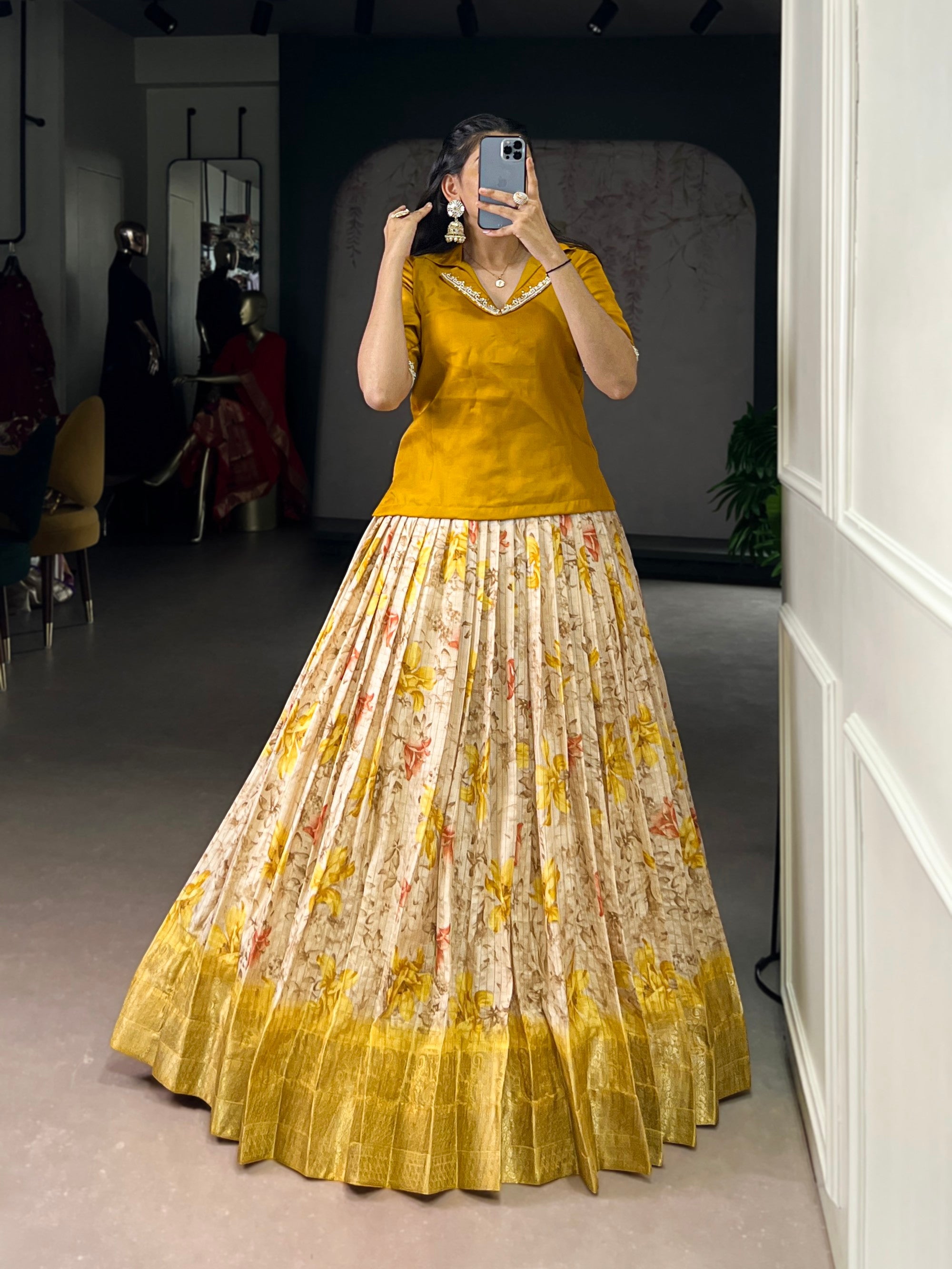 Bright yellow Dola Chex lehenga choli with floral prints and intricate Zari woven detailing