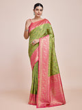 Parrot green Banarasi tissue silk saree with detailed Zari weaving.