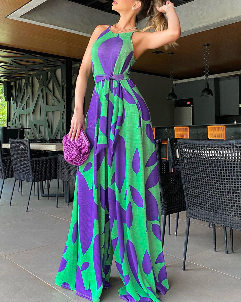 Green casual jumpsuit featuring a lace-up front design and printed pattern