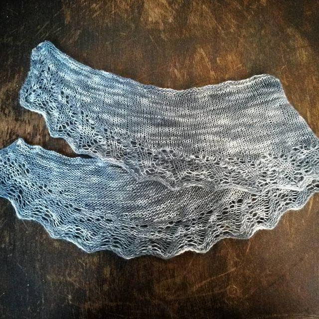 A finished hand-knit lace weight shawl made from the End of Summer Shawl Kit