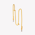 Yellow braided hands-free dog leash with gold hardware against a white background