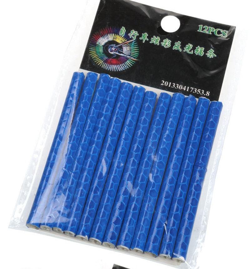 Set of 12 colorful reflective spoke clips in blue, red, and orange for bicycle wheels