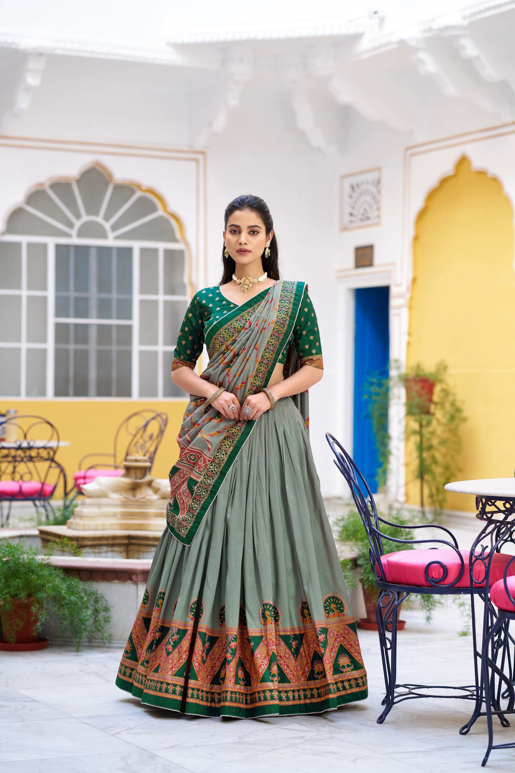 Green Tasar silk printed lehenga choli with sparkling accents and lace border.