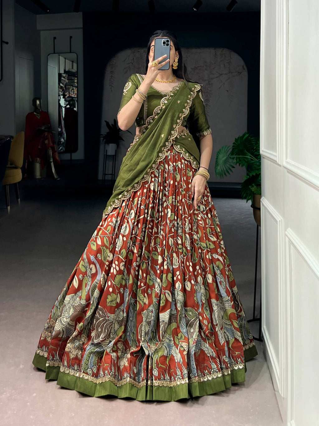 Multicolor Tasar silk lehenga choli with Kalamkari print and lace border details.