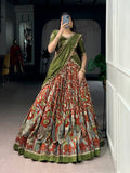 Multicolor Tasar silk lehenga choli with Kalamkari print and lace border details.