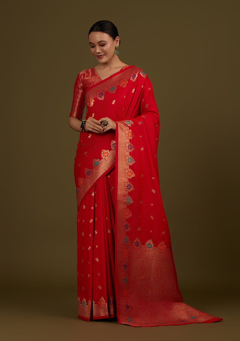 Red Banarasi silk blend saree with ornate zari woven patterns.