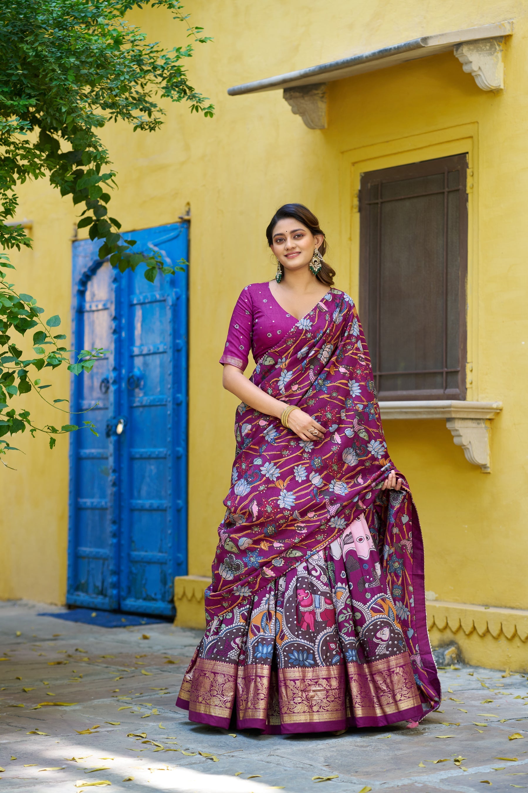 Multicolor Tussar silk lehenga with Kalamkari print and gold foil border.