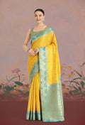 Classic yellow Banarasi tissue silk saree featuring traditional zari woven motifs.