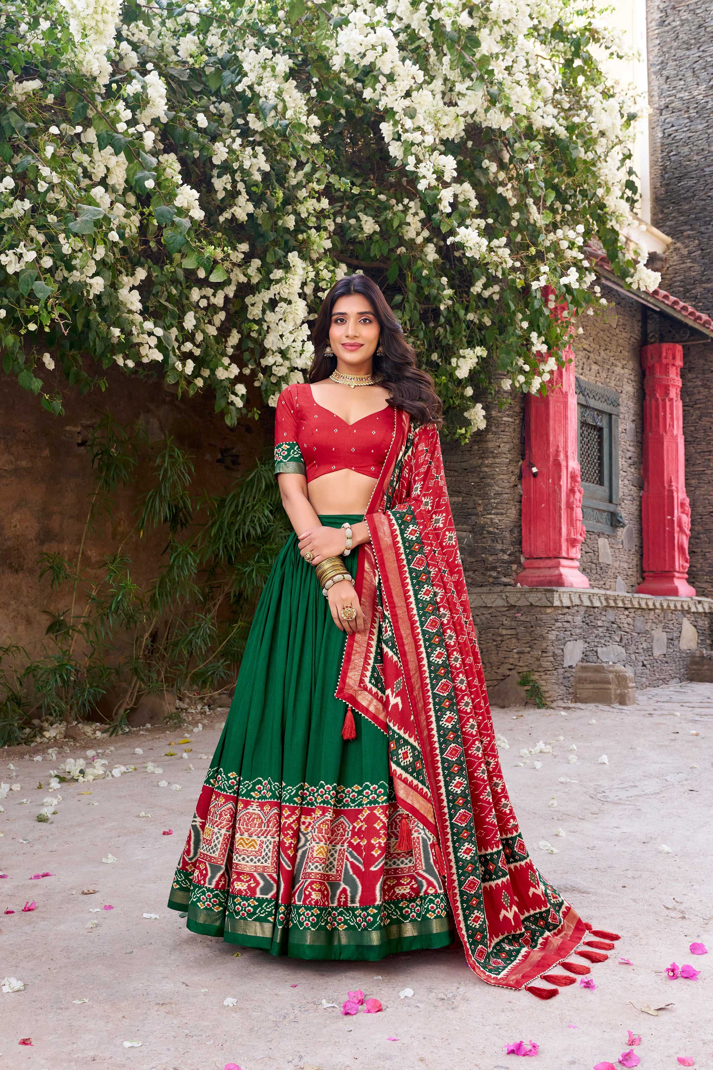 Green Tussar Silk Lehenga Choli with traditional Patola print and metallic foil work