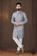 A stylish grey woven jacquard kurta paired with white pyjamas for boys