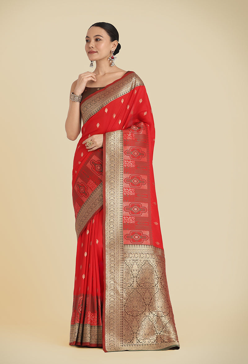 Traditional red Banarasi silk saree with detailed golden Zari woven border