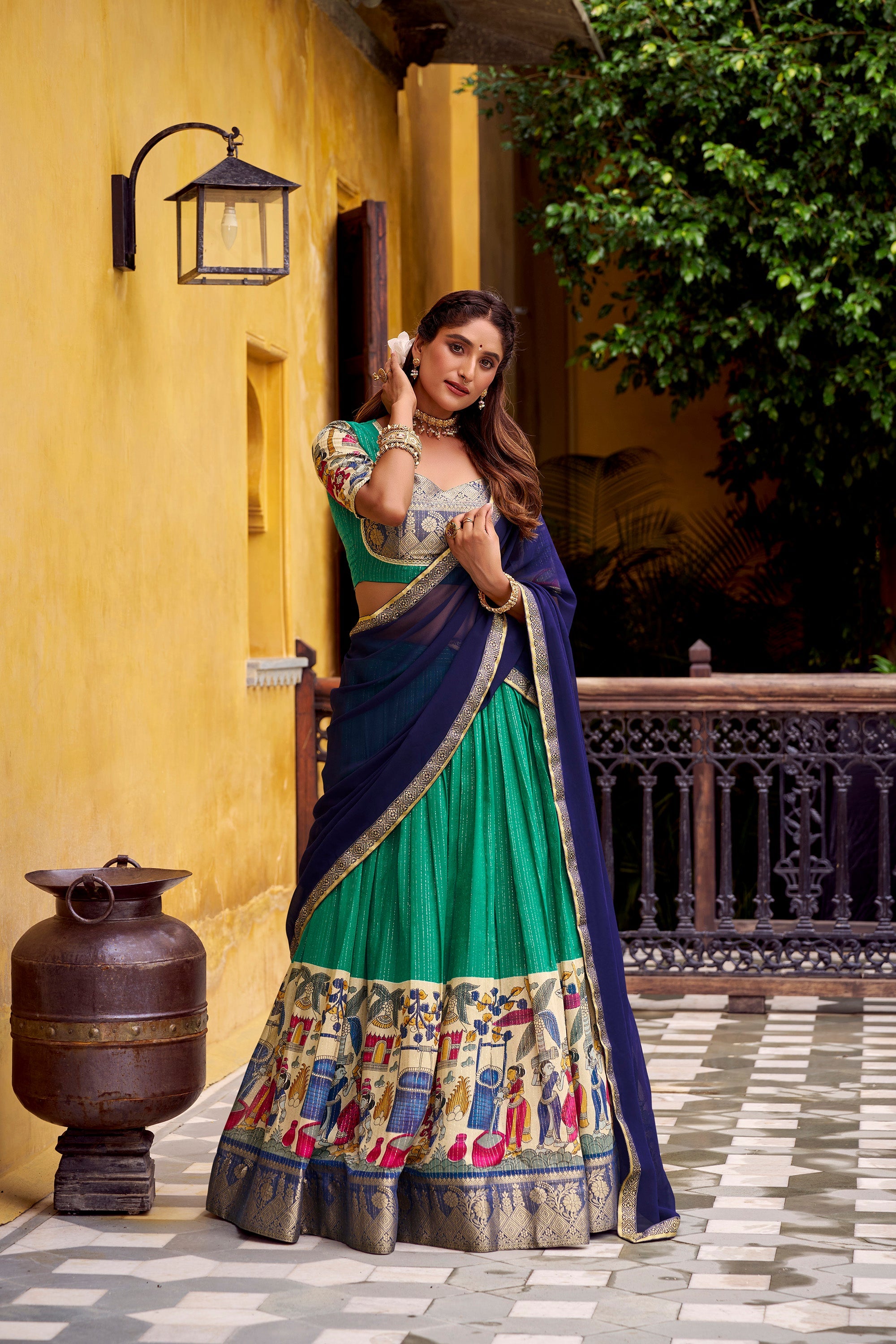 Multicolor poly chanderi lehenga choli in green and navy-blue with ethnic kalamkari prints.