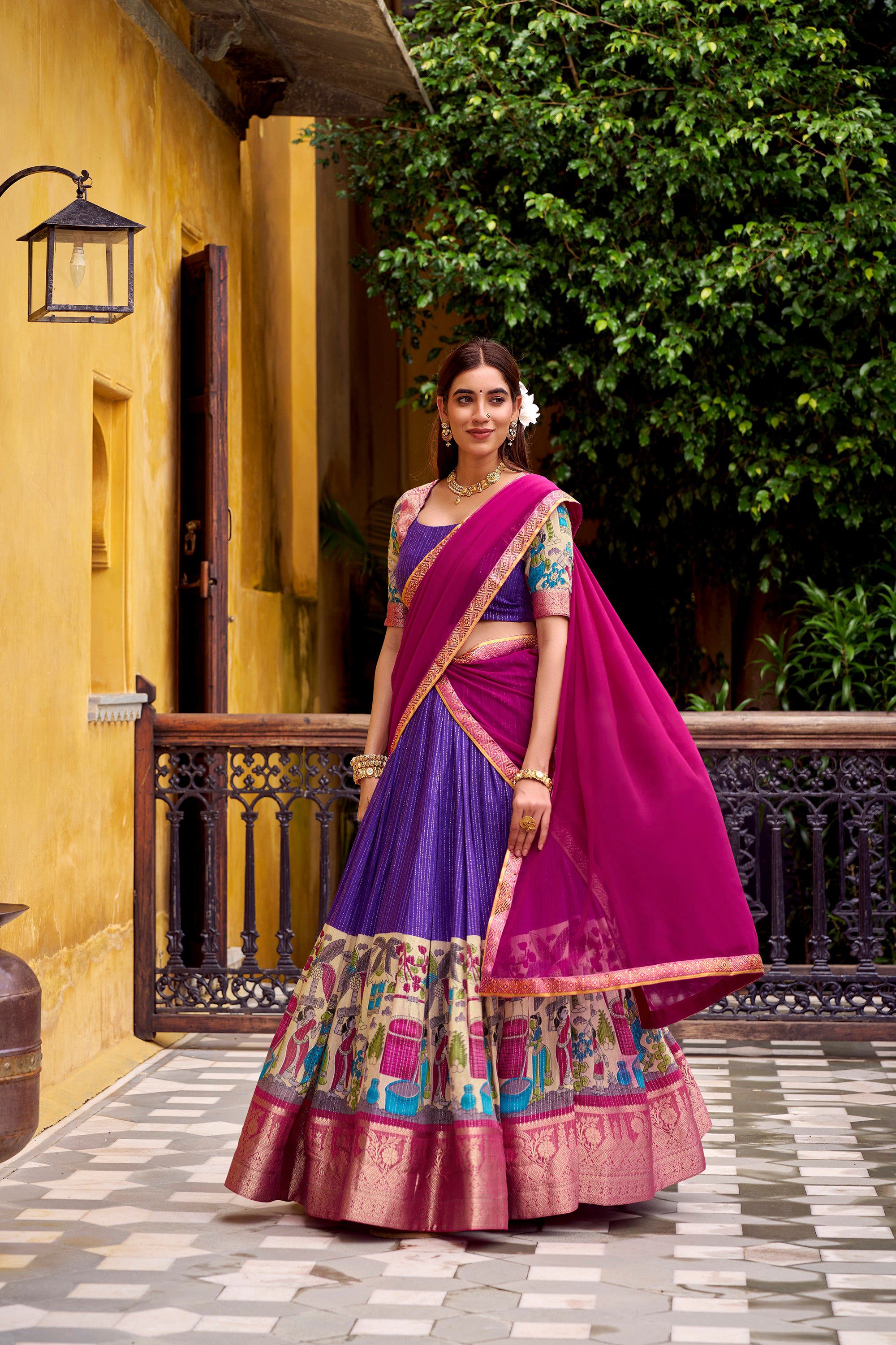 Purple and gold poly chanderi lehenga choli with traditional kalamkari prints and zari weaving.