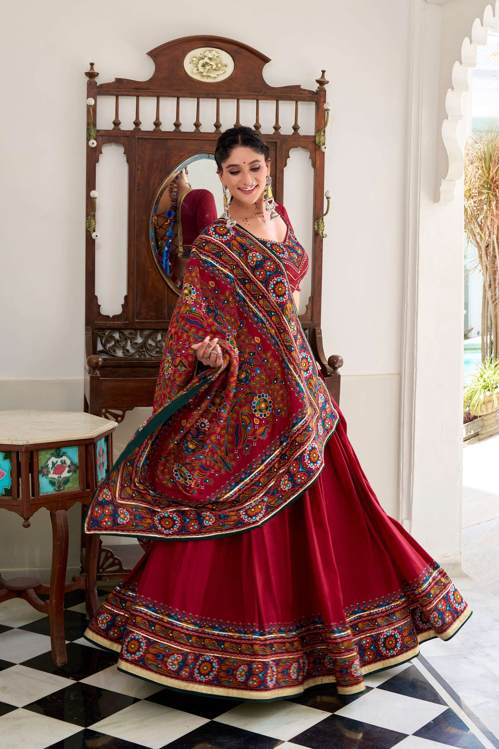 Red Tasar silk lehenga choli with traditional Gamthi print and Gotta Patti lace detailing