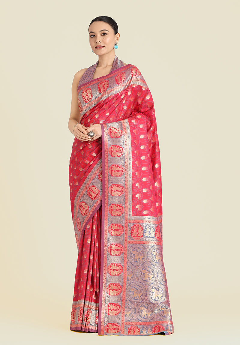 A beautiful pink Banarasi silk saree with gold zari woven traditional designs.