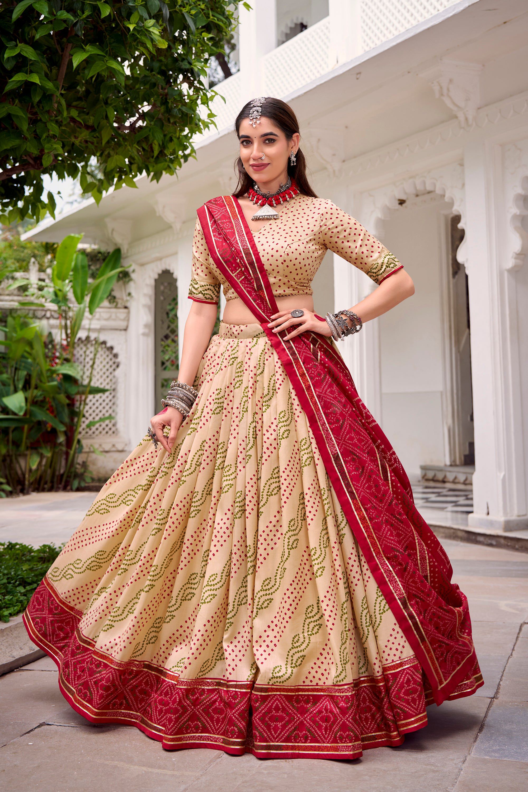 Offwhite Tasar silk lehenga with Bandhej print and Gotta Patti lace details